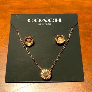 Beautiful Coach earring and necklace set. Rose gold color.